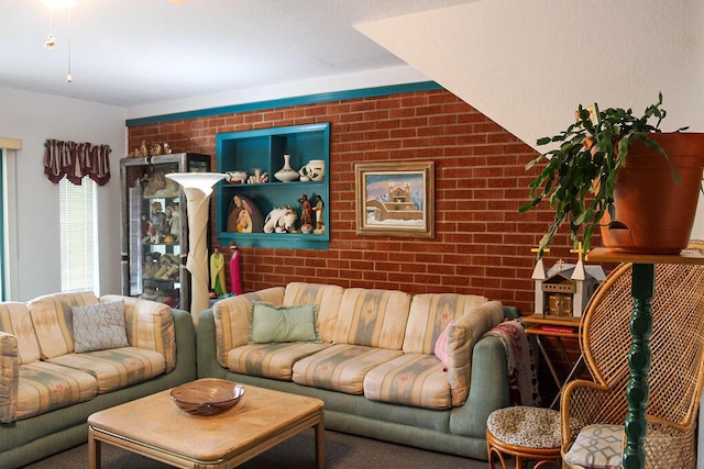 2701 Chapulin Rd SW, Albuquerque, NM 87105 - living area featuring brick wall