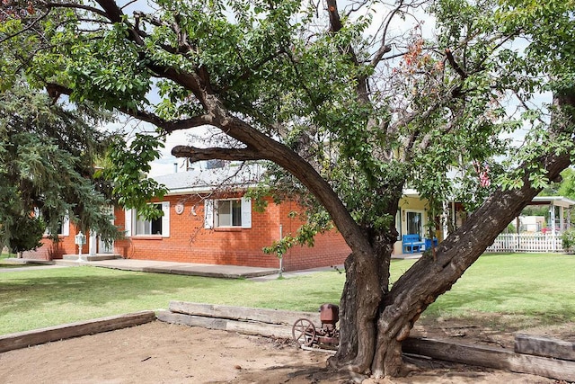 2701 Chapulin Rd SW, Albuquerque, NM 87105 - view of side of property with brick siding