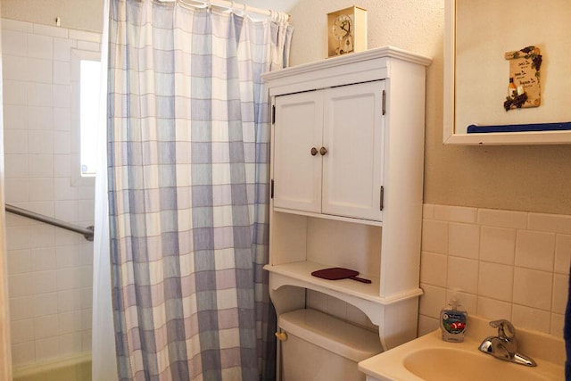 2701 Chapulin Rd SW, Albuquerque, NM 87105 - bathroom with a sink and tile walls
