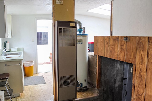 2701 Chapulin Rd SW, Albuquerque, NM 87105 - detailed view of water heater and a heating unit