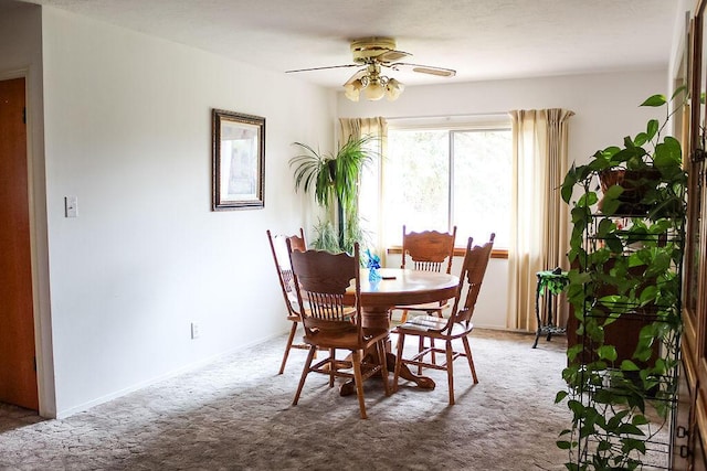 2701 Chapulin Rd SW, Albuquerque, NM 87105 - dining area with carpet floors and a ceiling fan