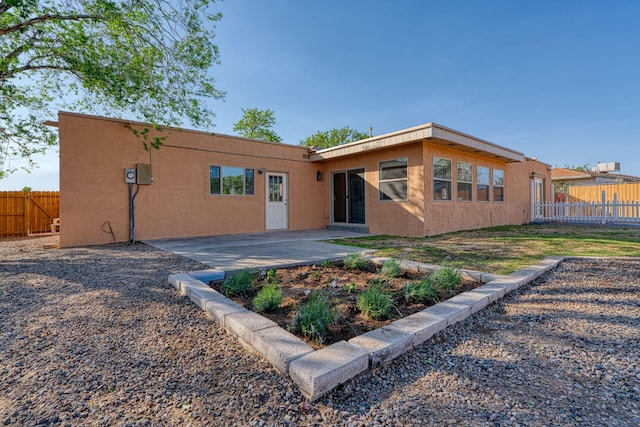 508 Las Marias Dr SE, Rio Rancho, NM 87124 - rear view of property with stucco siding and a patio
