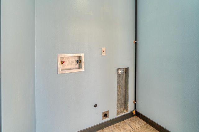 508 Las Marias Dr SE, Rio Rancho, NM 87124 - laundry area featuring electric dryer hookup, washer hookup, light tile patterned floors, and baseboards