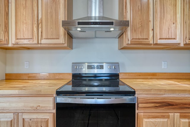 508 Las Marias Dr SE, Rio Rancho, NM 87124 - kitchen featuring range with electric cooktop, wall chimney exhaust hood, butcher block countertops, and light brown cabinets