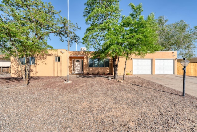 508 Las Marias Dr SE, Rio Rancho, NM 87124 - southwest-style home with concrete driveway, stucco siding, and a garage