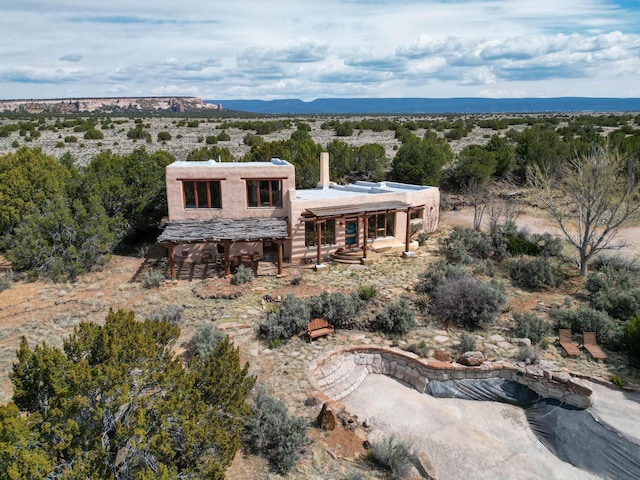 33 Kestrel Rd, Ramah, NM 87321 - view of front facade featuring a mountain view and a chimney