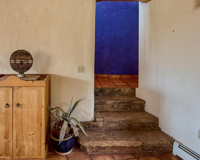 33 Kestrel Rd, Ramah, NM 87321 - staircase with baseboard heating