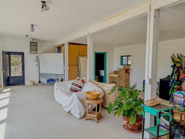 33 Kestrel Rd, Ramah, NM 87321 - living area featuring healthy amount of natural light and concrete flooring