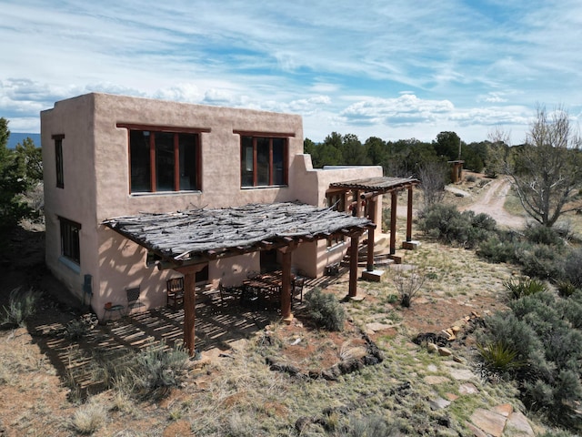 33 Kestrel Rd, Ramah, NM 87321 - back of house with stucco siding