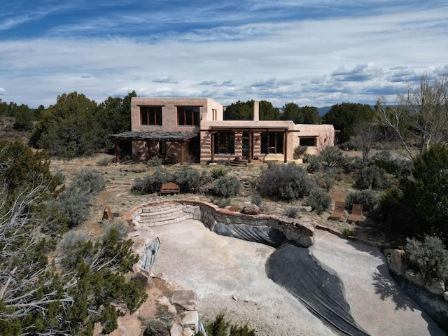 33 Kestrel Rd, Ramah, NM 87321 - back of property featuring a patio