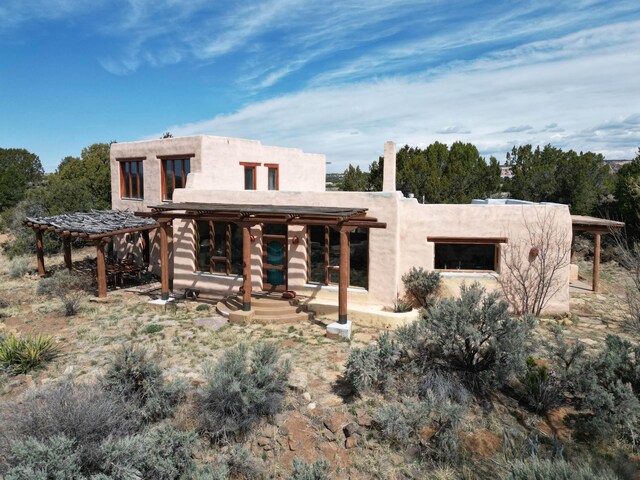 33 Kestrel Rd, Ramah, NM 87321 - view of home's exterior featuring stucco siding