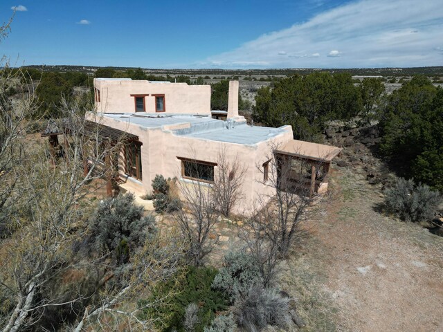 33 Kestrel Rd, Ramah, NM 87321 - view of home's exterior featuring stucco siding