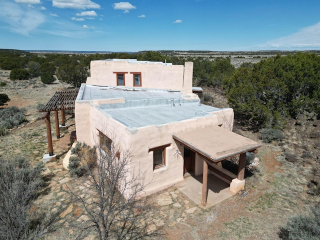 33 Kestrel Rd, Ramah, NM 87321 - back of property featuring stucco siding