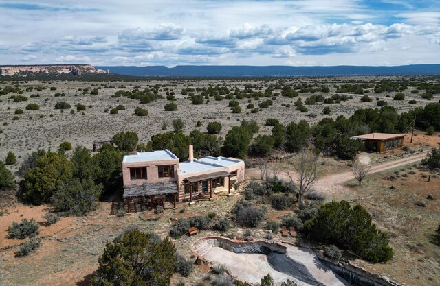 33 Kestrel Rd, Ramah, NM 87321 - aerial view of sparsely populated area with a desert landscape and a mountainous background