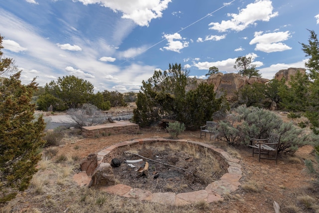 33 Kestrel Rd, Ramah, NM 87321 - view of yard featuring an outdoor fire pit