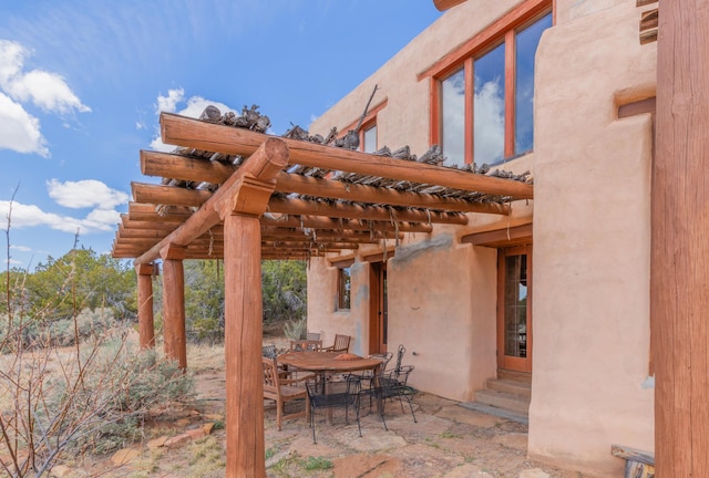 33 Kestrel Rd, Ramah, NM 87321 - view of patio / terrace featuring entry steps, a pergola, and outdoor dining area