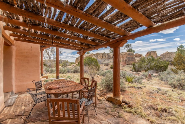 33 Kestrel Rd, Ramah, NM 87321 - view of patio featuring a pergola, a mountain view, and outdoor dining space