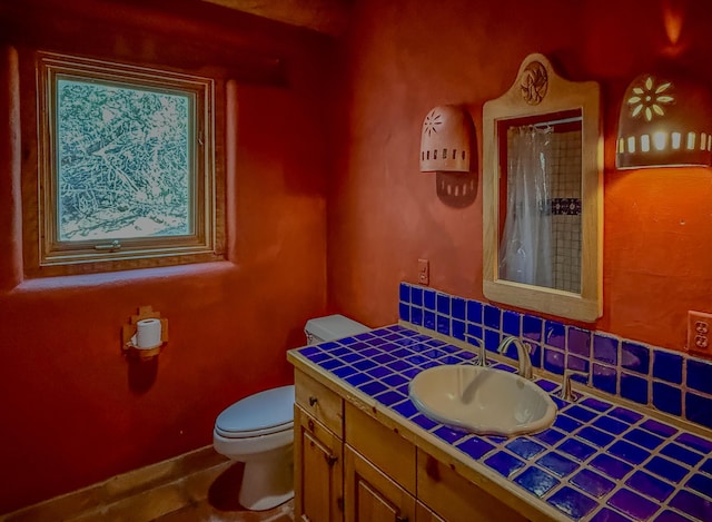 33 Kestrel Rd, Ramah, NM 87321 - bathroom with toilet, vanity, and curtained shower