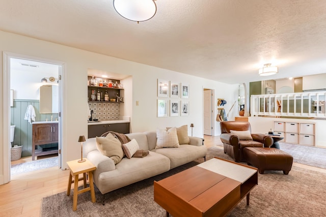 7416 Don Tomas Ln NE, Albuquerque, NM 87109 - living area featuring light wood-type flooring and a textured ceiling
