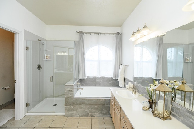 9301 Holm Bursun Dr NW, Albuquerque, NM 87114 - bathroom with a bath, a stall shower, tile patterned flooring, and vanity