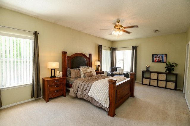 9301 Holm Bursun Dr NW, Albuquerque, NM 87114 - bedroom with light colored carpet and a ceiling fan
