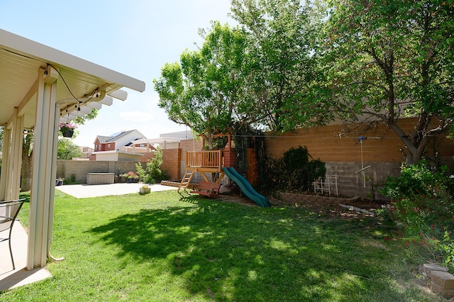 9301 Holm Bursun Dr NW, Albuquerque, NM 87114 - fenced backyard with a playground and a patio area
