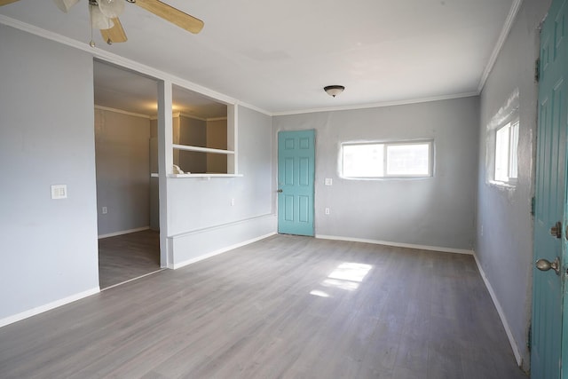 314 S 9th Ave, Estancia, NM 87016 - unfurnished room featuring ornamental molding, wood finished floors, a ceiling fan, and baseboards