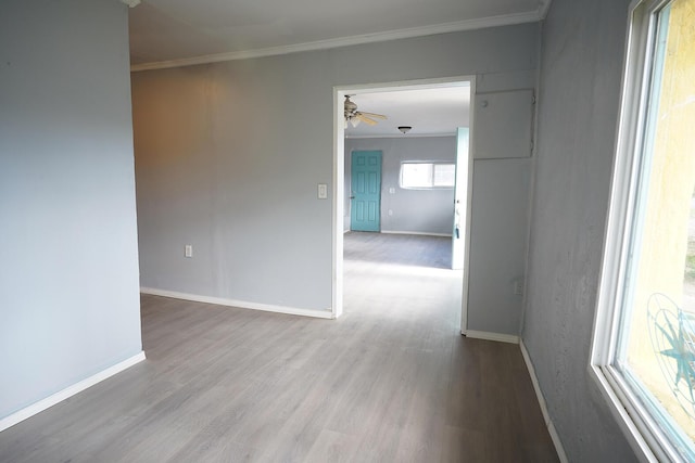 314 S 9th Ave, Estancia, NM 87016 - unfurnished room with wood finished floors, ceiling fan, ornamental molding, and baseboards