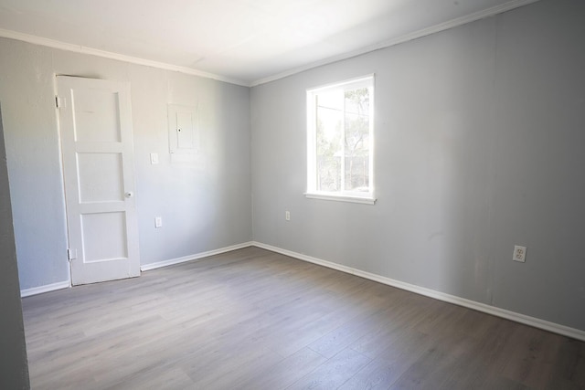 314 S 9th Ave, Estancia, NM 87016 - unfurnished room with wood finished floors, crown molding, and baseboards