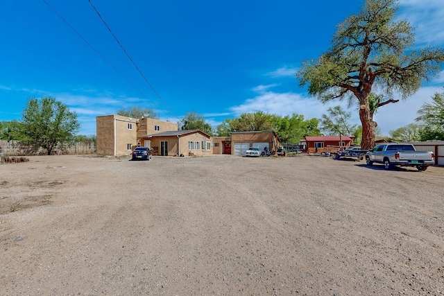 2327 Pajarito Rd SW, Albuquerque, NM 87105 - view of front of house with uncovered parking and fence
