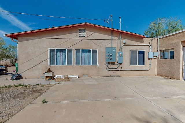 2327 Pajarito Rd SW, Albuquerque, NM 87105 - back of property with stucco siding and a patio area
