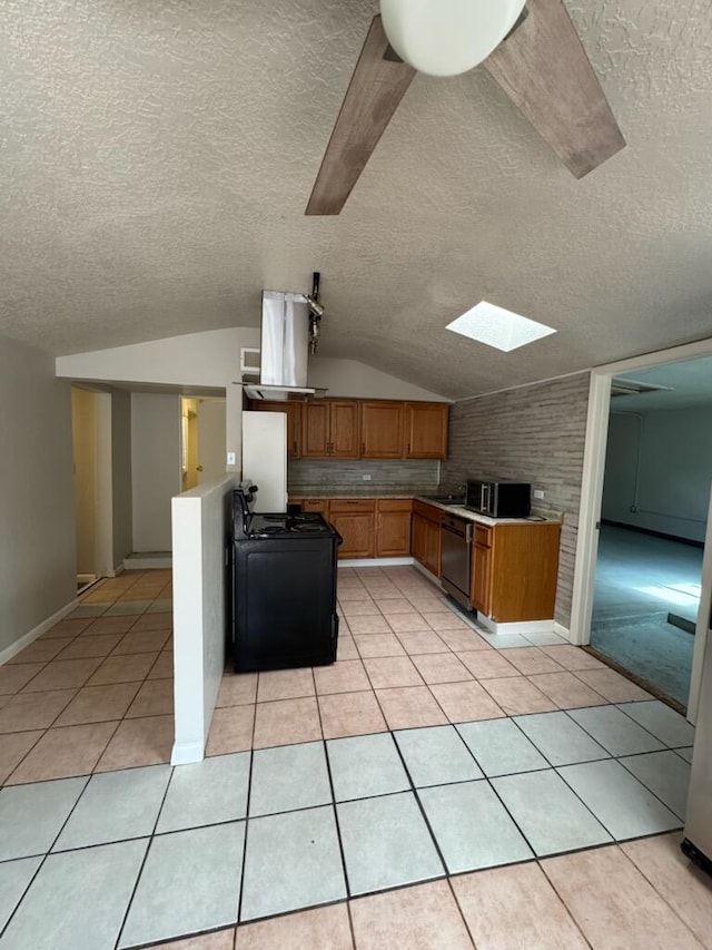 2327 Pajarito Rd SW, Albuquerque, NM 87105 - kitchen featuring dishwashing machine, extractor fan, a textured ceiling, a skylight, and lofted ceiling