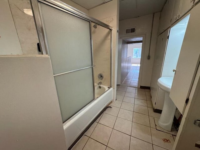 2327 Pajarito Rd SW, Albuquerque, NM 87105 - bathroom featuring tile patterned floors and combined bath / shower with glass door