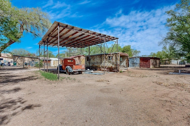 2327 Pajarito Rd SW, Albuquerque, NM 87105 - view of parking featuring a carport