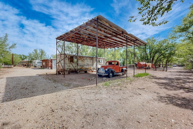 2327 Pajarito Rd SW, Albuquerque, NM 87105 - view of vehicle parking featuring a carport