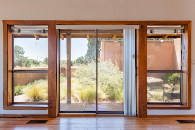 3121 Grande Vista Pl NW, Albuquerque, NM 87120 - doorway to outside featuring wood finished floors and healthy amount of natural light