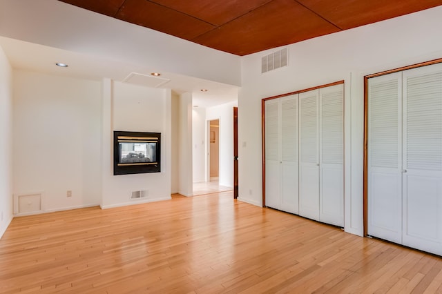 3121 Grande Vista Pl NW, Albuquerque, NM 87120 - unfurnished bedroom with two closets, light wood-type flooring, baseboards, and recessed lighting