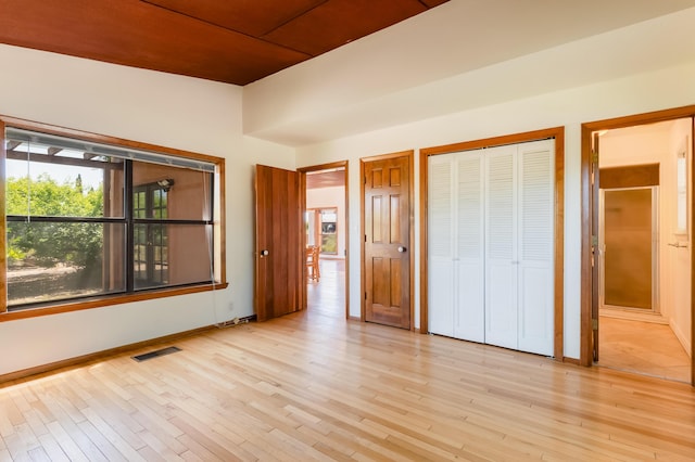 3121 Grande Vista Pl NW, Albuquerque, NM 87120 - unfurnished bedroom featuring multiple windows, light wood-type flooring, and baseboards
