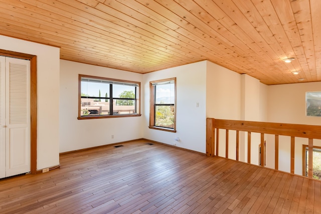 3121 Grande Vista Pl NW, Albuquerque, NM 87120 - unfurnished room featuring wooden ceiling, hardwood / wood-style floors, and baseboards