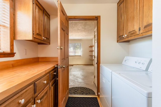 3121 Grande Vista Pl NW, Albuquerque, NM 87120 - laundry room featuring cabinet space, a textured ceiling, washing machine and clothes dryer, and light carpet