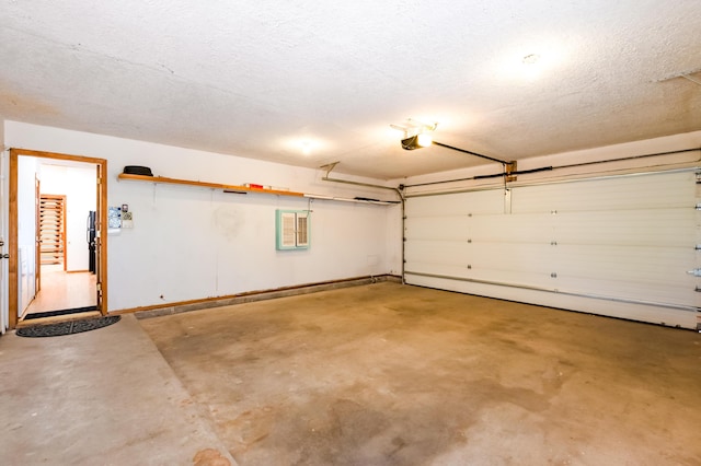 3121 Grande Vista Pl NW, Albuquerque, NM 87120 - garage featuring a garage door opener and baseboards