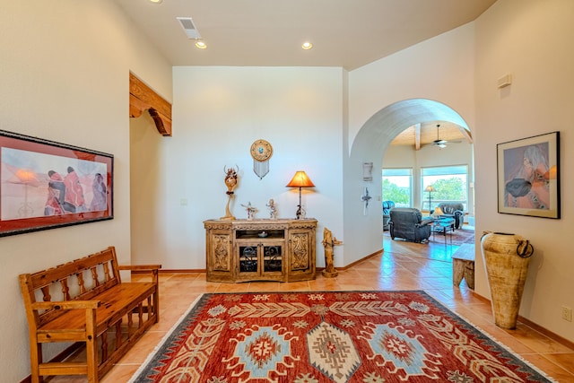 2392 Manzano Loop NE, Rio Rancho, NM 87144 - hall with light tile patterned flooring, arched walkways, baseboards, and recessed lighting