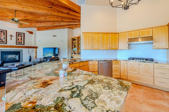 2392 Manzano Loop NE, Rio Rancho, NM 87144 - kitchen featuring light brown cabinets, under cabinet range hood, open floor plan, a sink, and stainless steel appliances