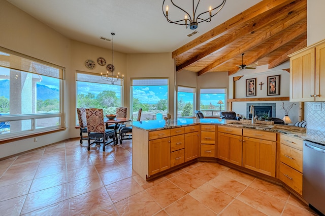 2392 Manzano Loop NE, Rio Rancho, NM 87144 - kitchen featuring a chandelier, stainless steel dishwasher, a sink, beam ceiling, and a fireplace