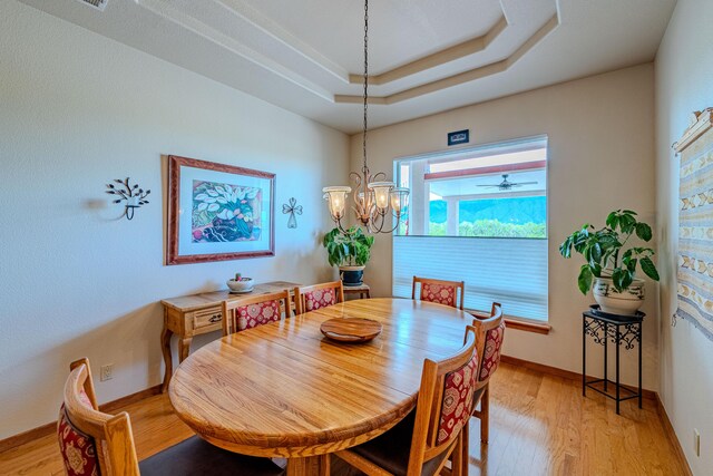 2392 Manzano Loop NE, Rio Rancho, NM 87144 - dining space featuring light wood-style floors, baseboards, and a chandelier