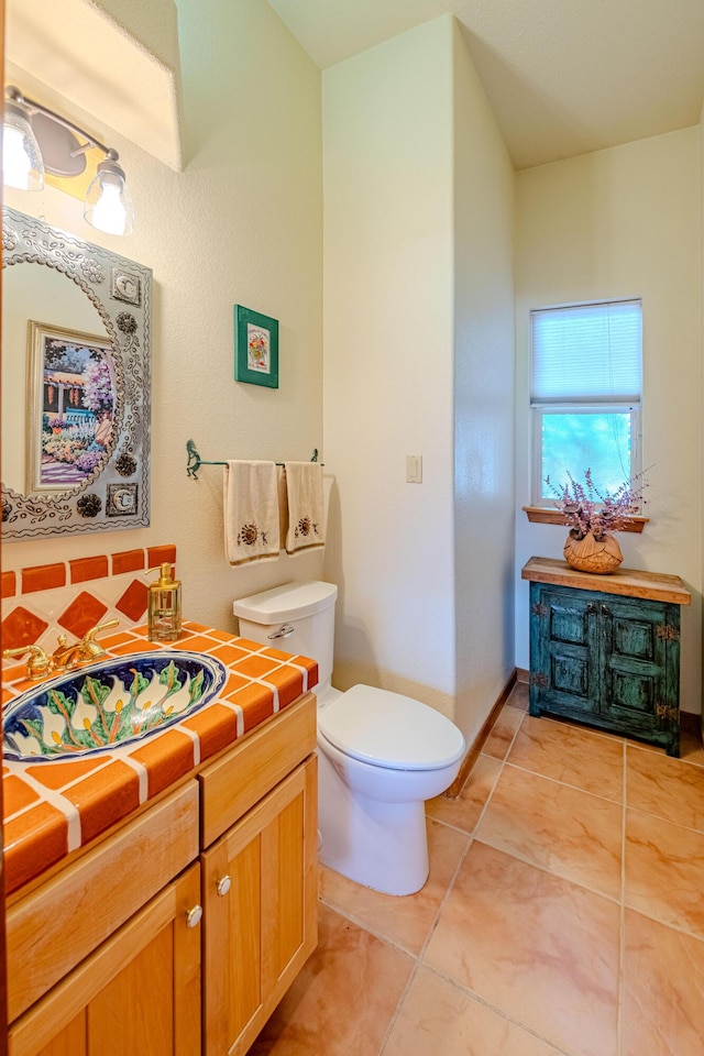2392 Manzano Loop NE, Rio Rancho, NM 87144 - half bath featuring toilet, tile patterned flooring, and vanity
