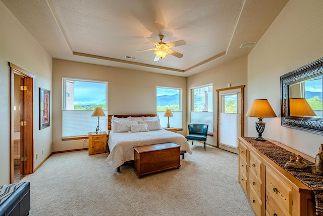 2392 Manzano Loop NE, Rio Rancho, NM 87144 - bedroom with a raised ceiling, light carpet, baseboards, access to exterior, and a ceiling fan