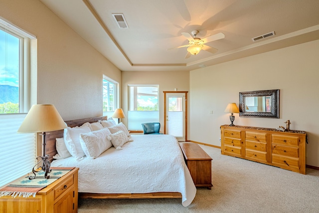 2392 Manzano Loop NE, Rio Rancho, NM 87144 - bedroom with light carpet, access to exterior, a ceiling fan, and baseboards