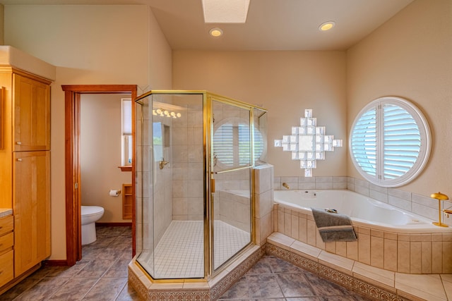 2392 Manzano Loop NE, Rio Rancho, NM 87144 - full bathroom with a stall shower, a bath, toilet, a skylight, and recessed lighting