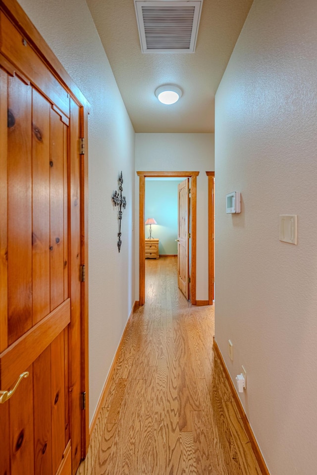 2392 Manzano Loop NE, Rio Rancho, NM 87144 - hallway featuring light wood finished floors and baseboards